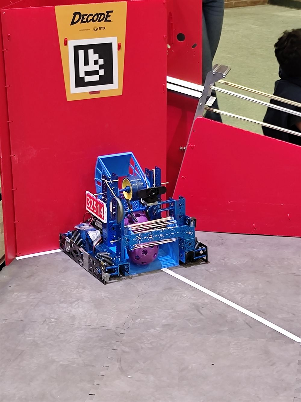 MechLyons robot 32514 lined up at the red goal during a DECODE season match